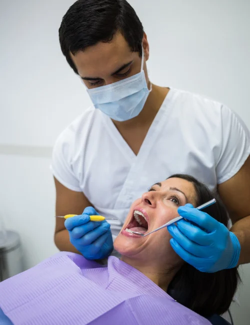 dentist-examining-female-patient-teeth-dental-implant dentist-examining-female-patient-teeth-dental-implant